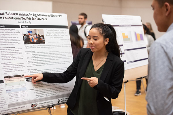 student with poster