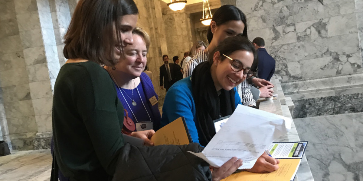 Hilary with students at State Capitol 