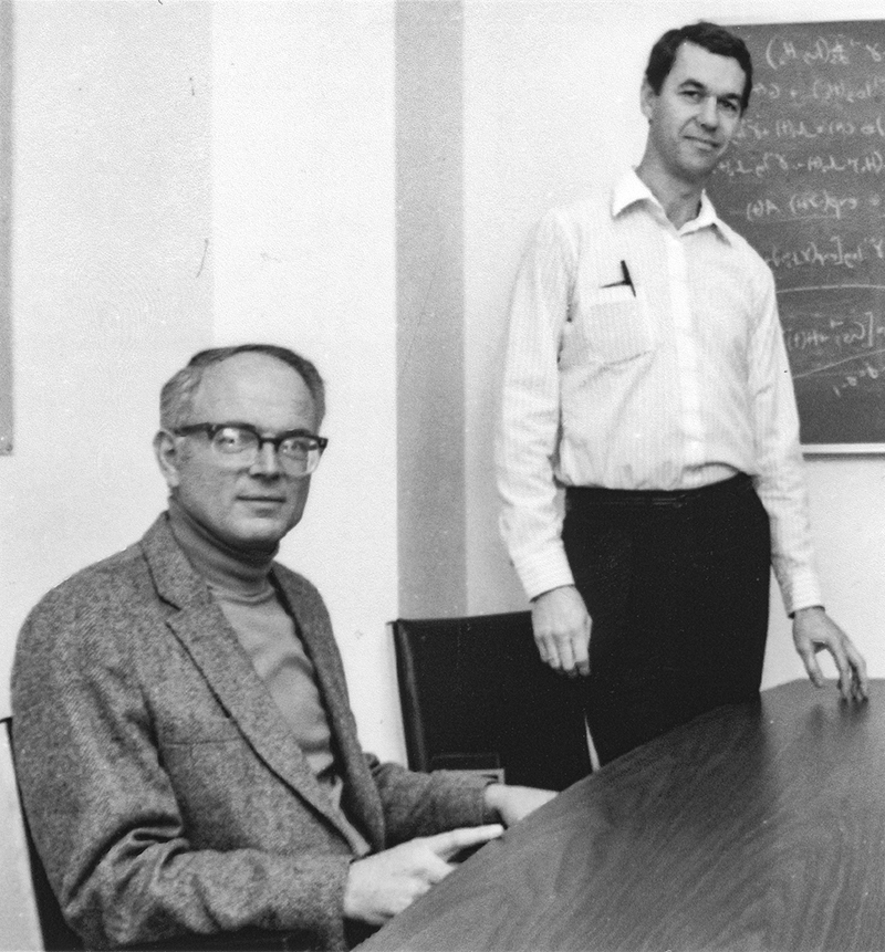 David Thomas and Ross Prentice at a conference table