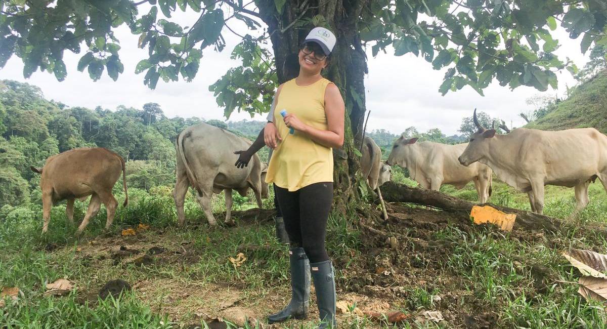 PhD student Viviana Albán on a farm