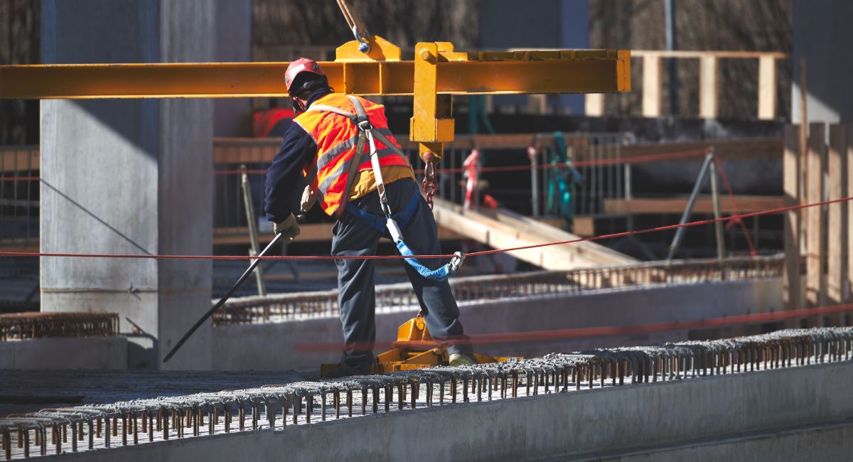 Construction worker with harness