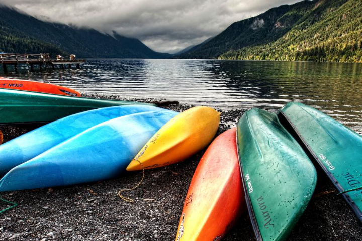 Canoes on a beach by a lake