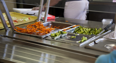 Cafeteria with tubs of food