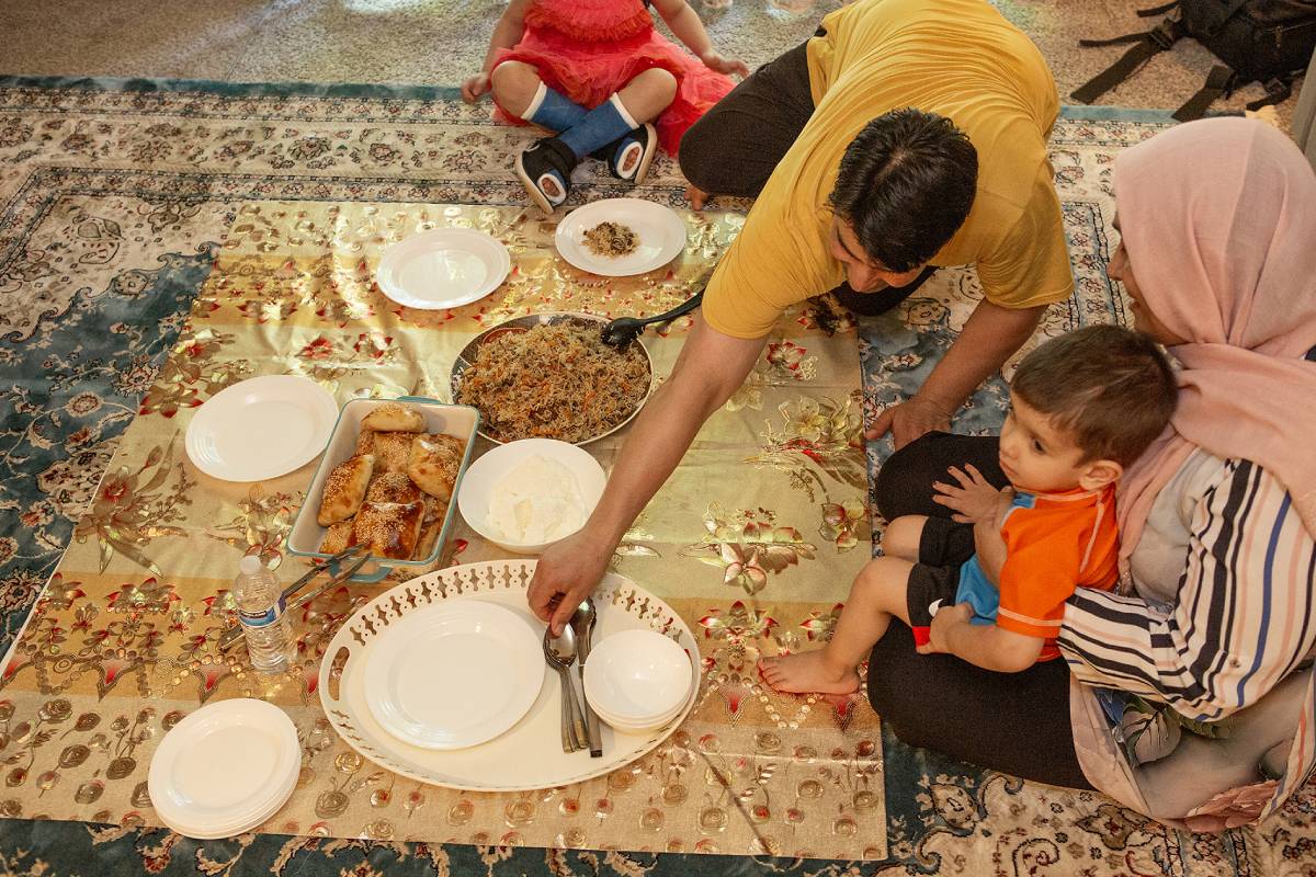 A Seattle Afghan family eats a meal together