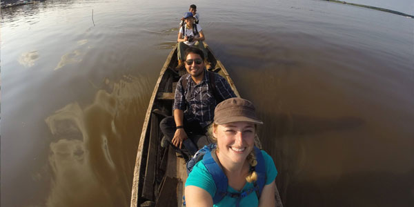 Jorge Alarcon, Leann Andrew and others on a boat on the Amazon River