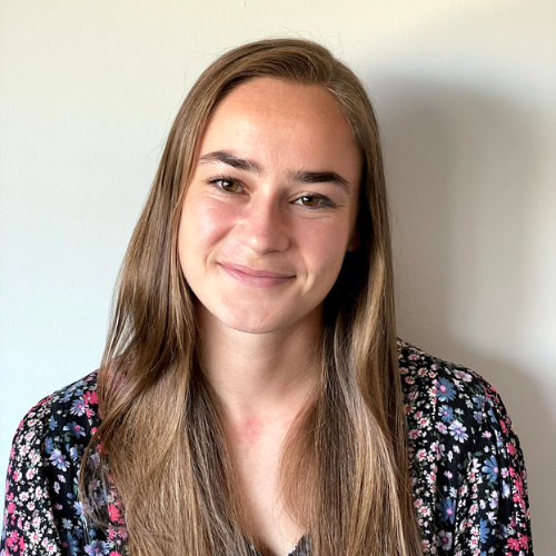 Carolyn Graham smiles against plain background
