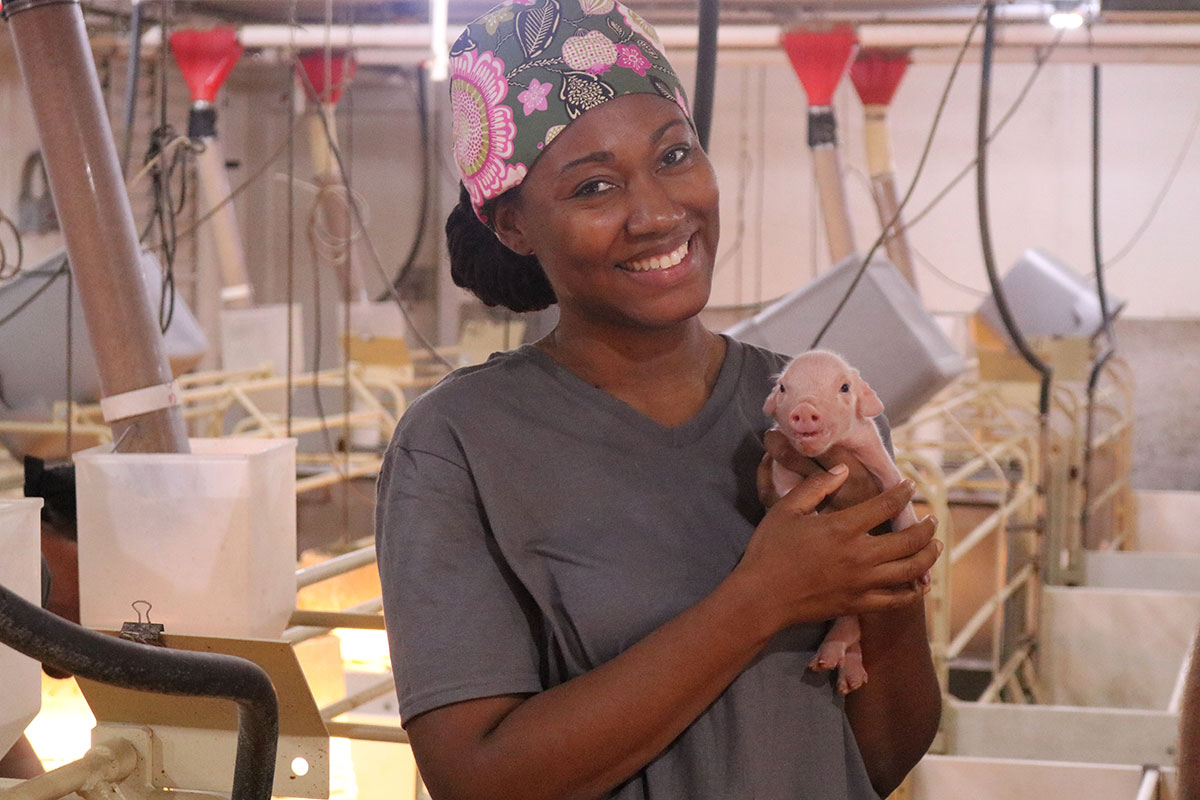 Heather Fowler holding pig