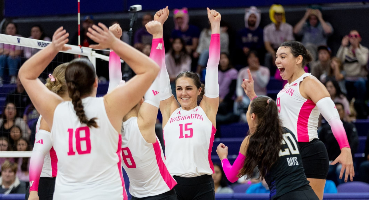 Sophia and volleyball teammates raise arms in celebration on court