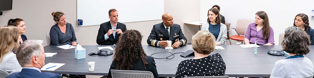 Jerome Adams talking to students