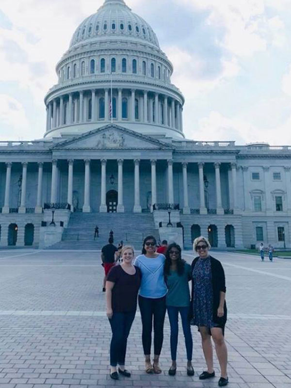 Priyanka Gautom (2nd from left) in front of the U.S. Capitol Building.