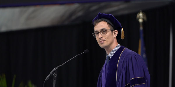 Christopher Kemp gives the Omenn Award Winner speech at the SPH graduation celebration on June 16.