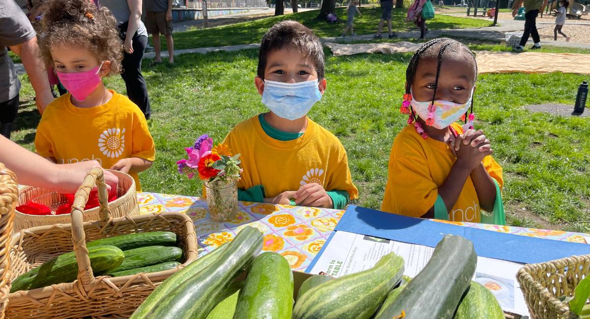 Preschoolers shop for local Washington produce at a pop-up market