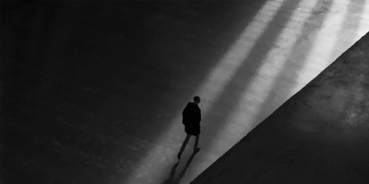 Black and white illustration - human figure walking into the light