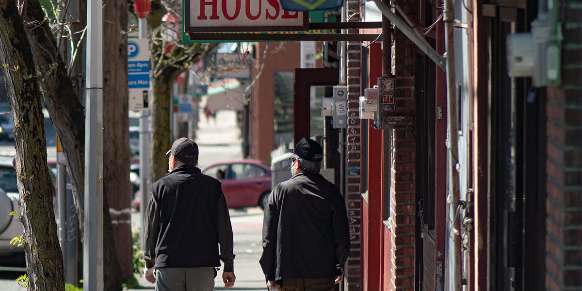 Older adults walking through the International District