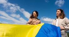 Olena and Olga with Ukrainian Flag